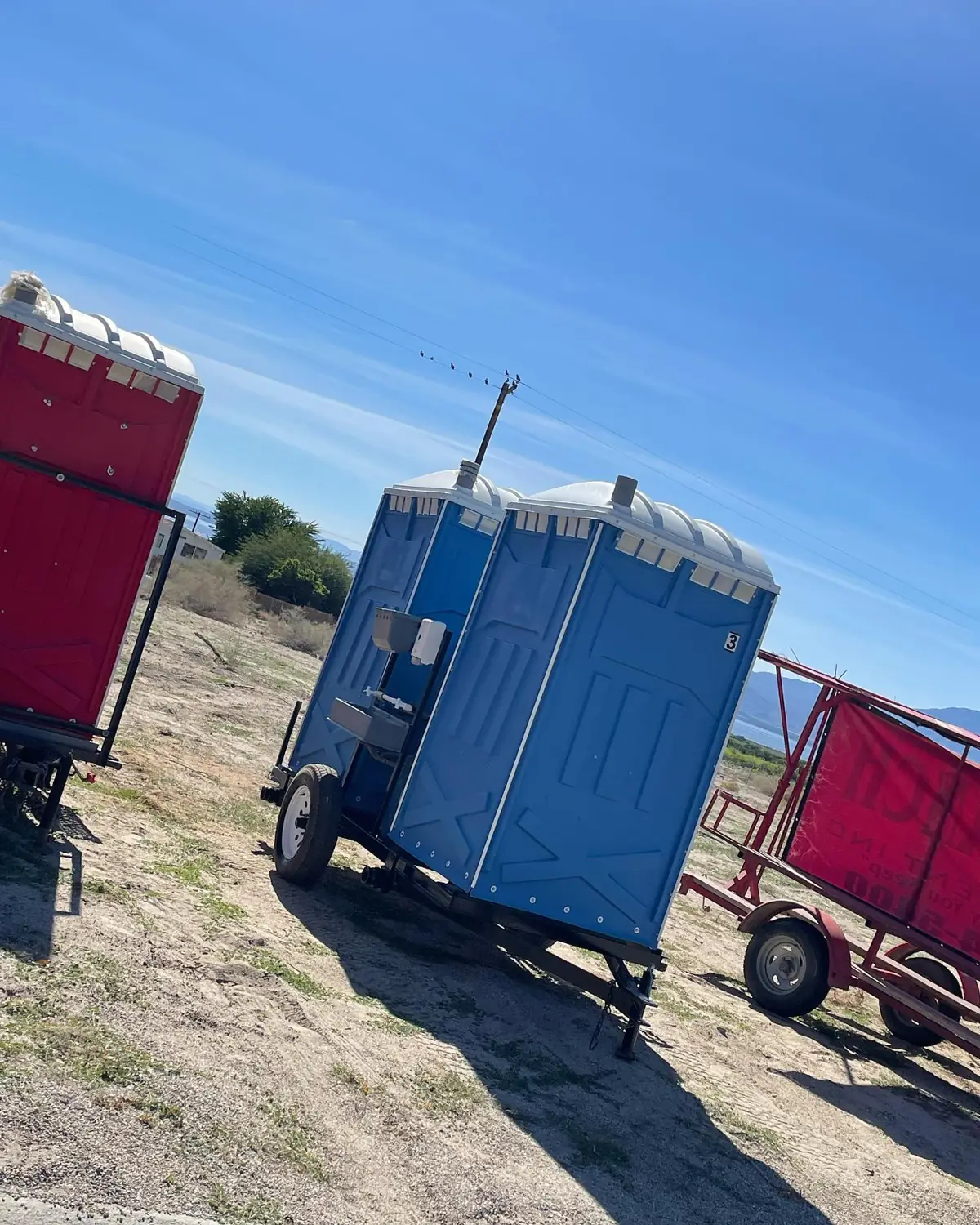 Towable porta potties at a job site
